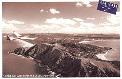 Byron Bay Lighthouse and Motor Glider postcard.